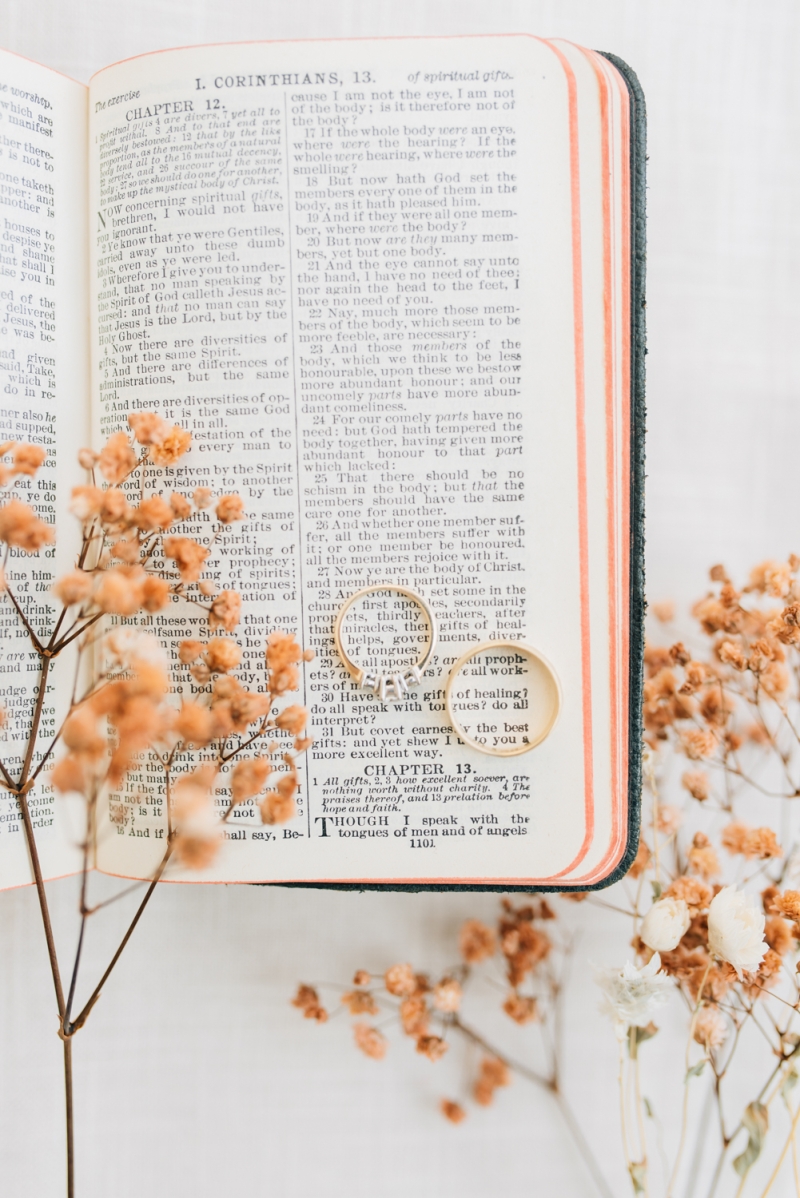 _A1S2831 1 corinthians 13 wedding photography with rings on bible