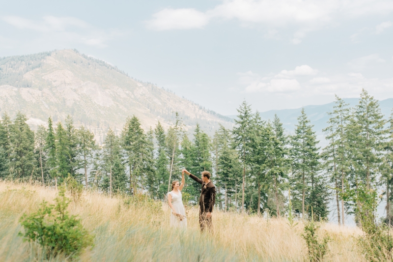 _A1S3213 Groom twirling a bride in Farragut state park near Coeur D'alene, Idaho.