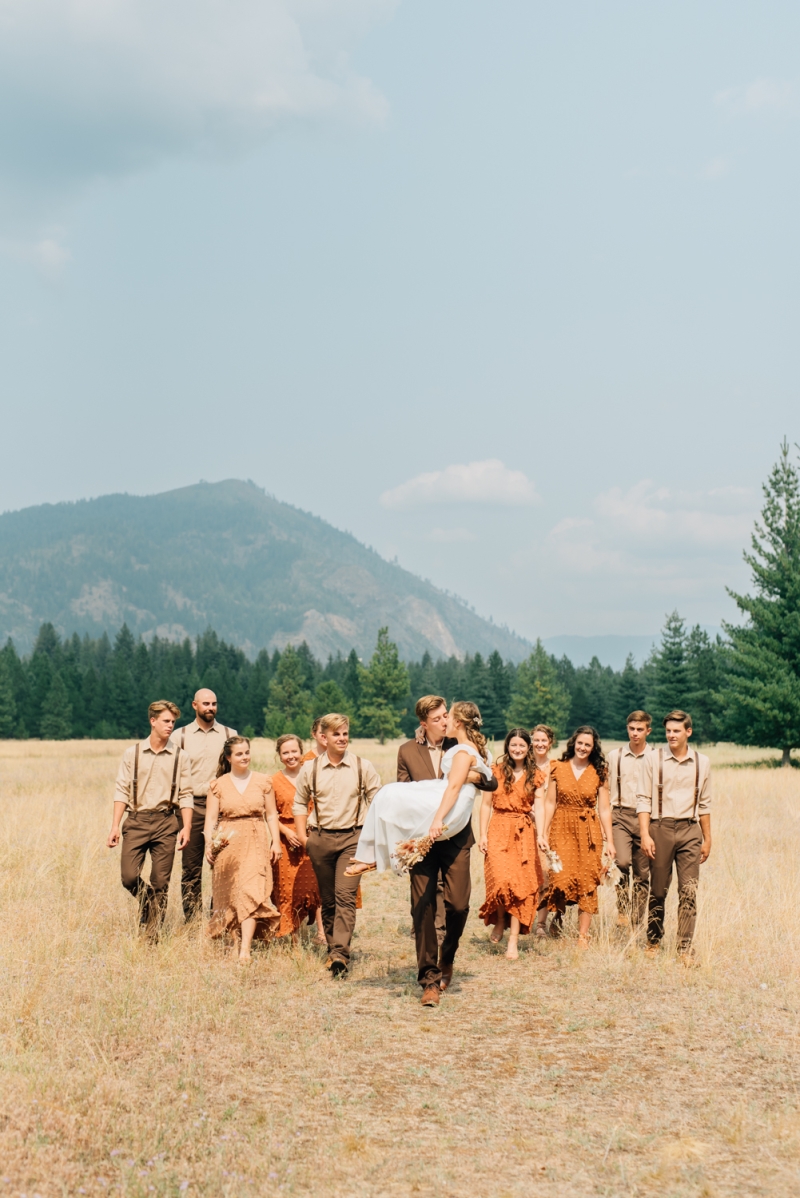 _A1S3880 wedding party photography walking through Farragut state park. sunny summer wedding near Coeur D'alene Idaho