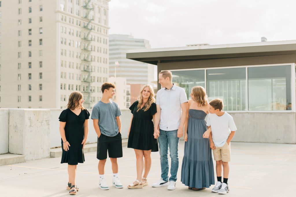 _A1S5978 An urban family photo session on top of the Grand hotel in downtown spokane wa.